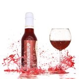 Zirbensirup in Glasflasche und in Weinglas